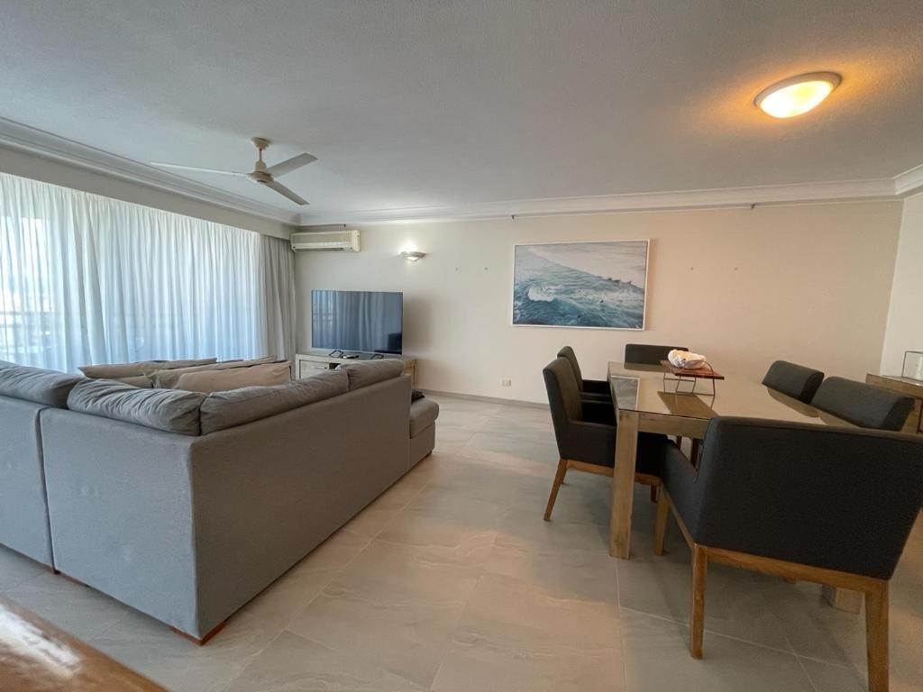 a living room with a couch and a table at Crown Towers Resort Apartments in Gold Coast
