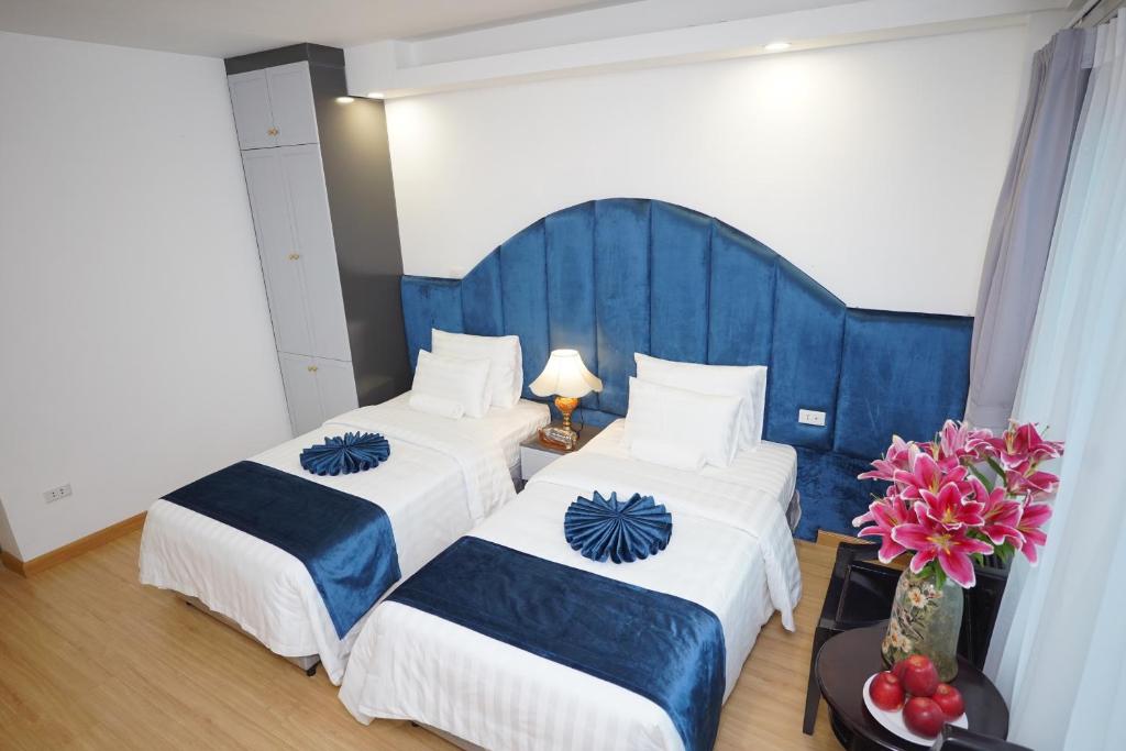 Postel nebo postele na pokoji v ubytování Hanoi Capital Premium Hotel