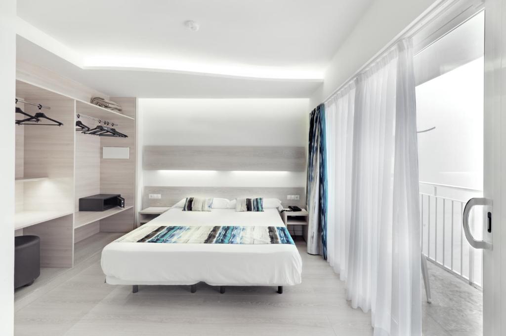 Postel nebo postele na pokoji v ubytování Hotel Gracia