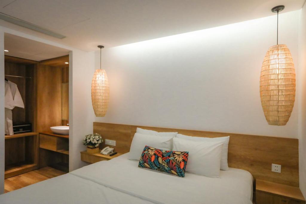 Postel nebo postele na pokoji v ubytování K House Apartment Danang Beach