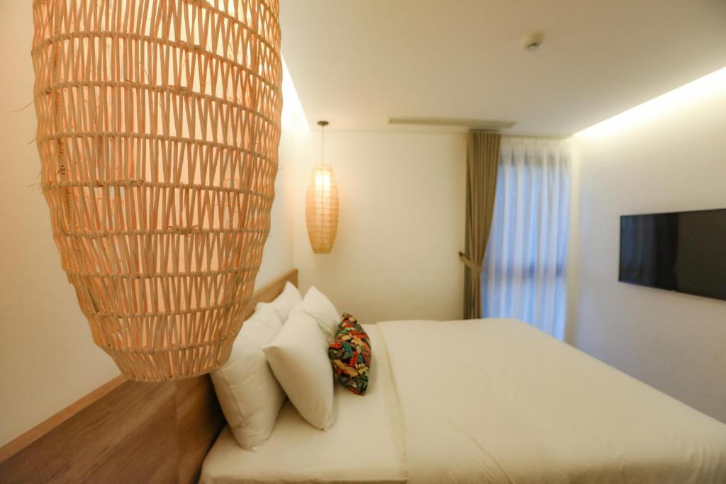 Giường trong phòng chung tại K House Apartment Danang Beach