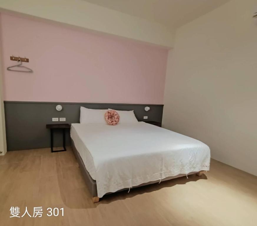 Postel nebo postele na pokoji v ubytování 佳宏馥居民宿