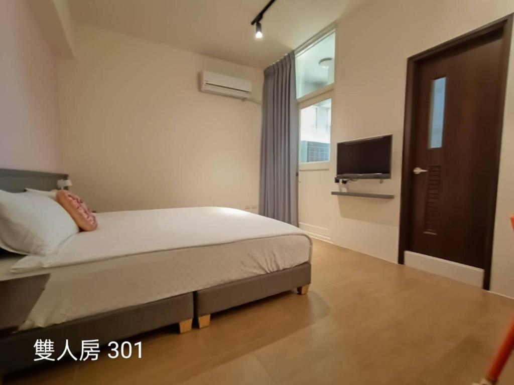 Postel nebo postele na pokoji v ubytování 佳宏馥居民宿