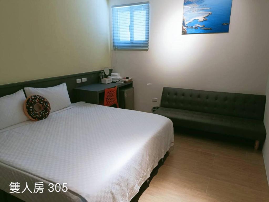 Postel nebo postele na pokoji v ubytování 佳宏馥居民宿