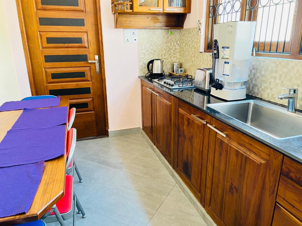 Kuchyň nebo kuchyňský kout v ubytování Hansons Homestay