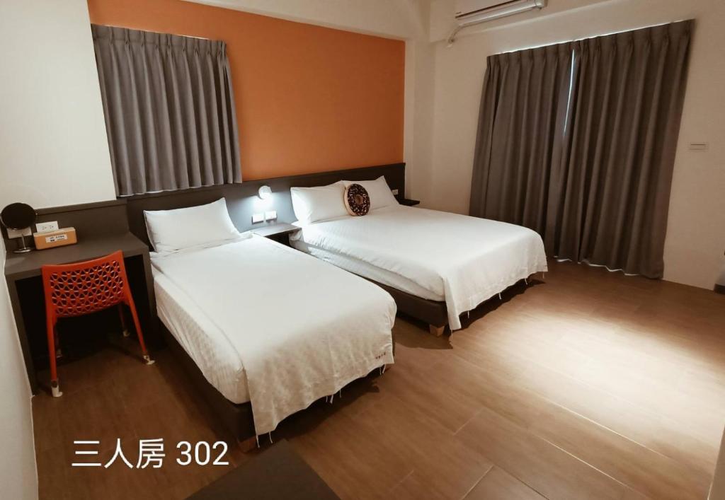 Postel nebo postele na pokoji v ubytování 佳宏馥居民宿