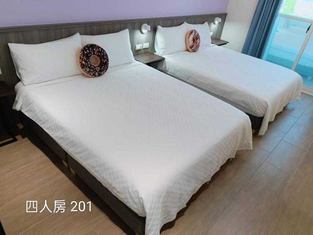 Postel nebo postele na pokoji v ubytování 佳宏馥居民宿