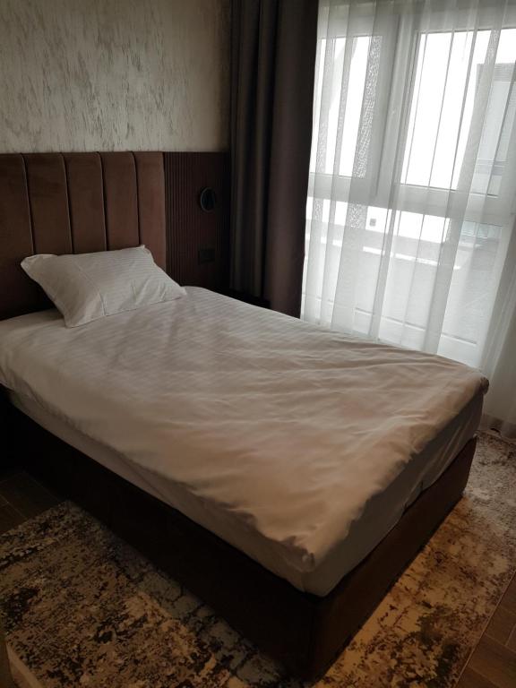 Postel nebo postele na pokoji v ubytování MY HOTEL