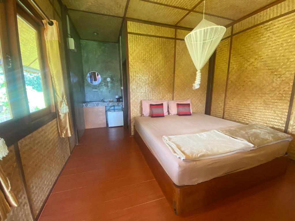 Postel nebo postele na pokoji v ubytování Pai Smilehouse