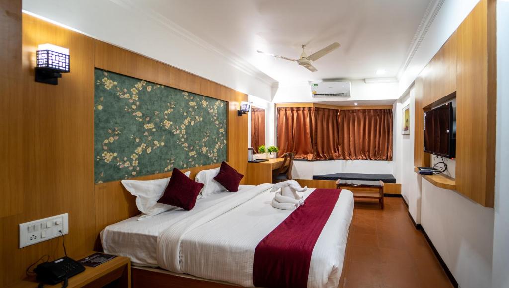 Postel nebo postele na pokoji v ubytování Hotel Kewal