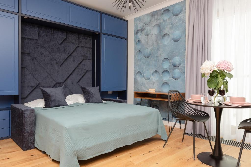 Posteľ alebo postele v izbe v ubytovaní Łazienki Park Residence by Renters Prestige