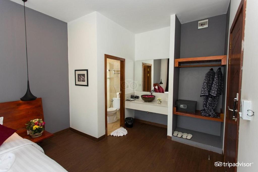 Postel nebo postele na pokoji v ubytování Siem Reap Tevi Residence