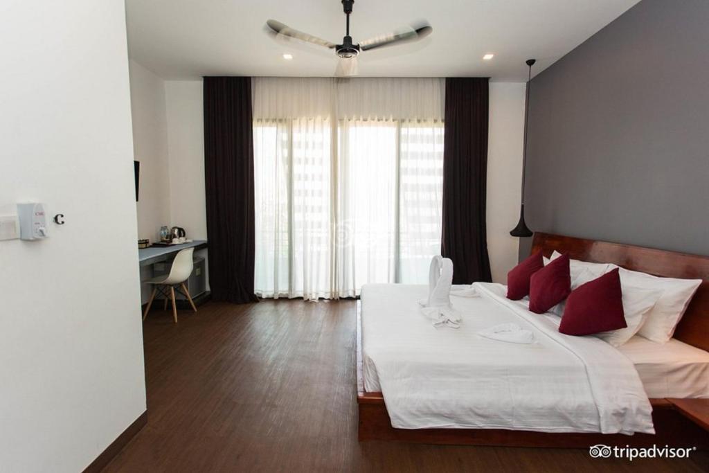 Postel nebo postele na pokoji v ubytování Siem Reap Tevi Residence