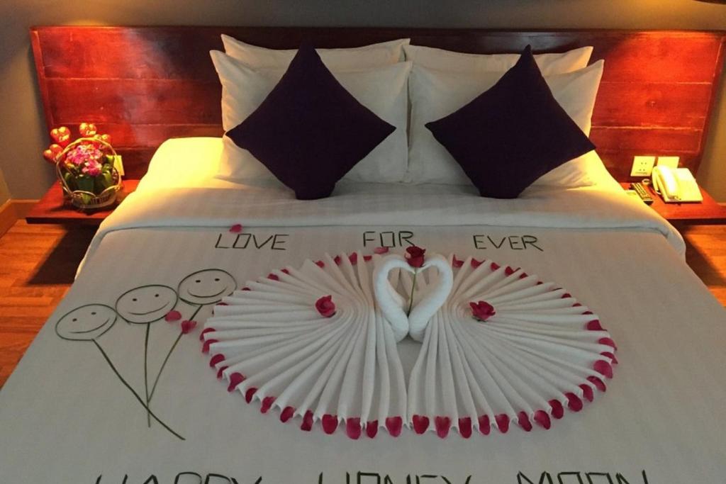 Postel nebo postele na pokoji v ubytování Siem Reap Tevi Residence