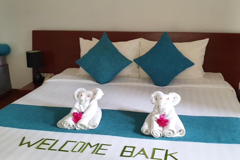Postel nebo postele na pokoji v ubytování Siem Reap Tevi Residence