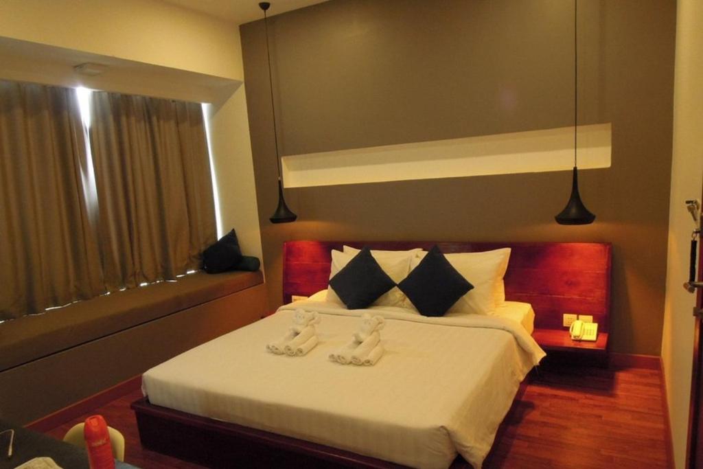 Postel nebo postele na pokoji v ubytování Siem Reap Tevi Residence