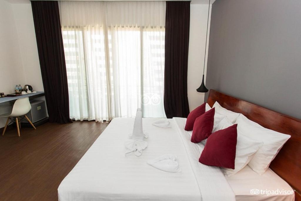 Postel nebo postele na pokoji v ubytování Siem Reap Tevi Residence
