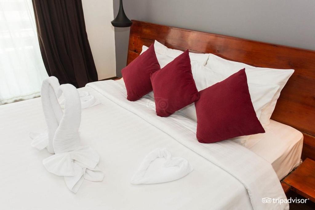 Postel nebo postele na pokoji v ubytování Siem Reap Tevi Residence