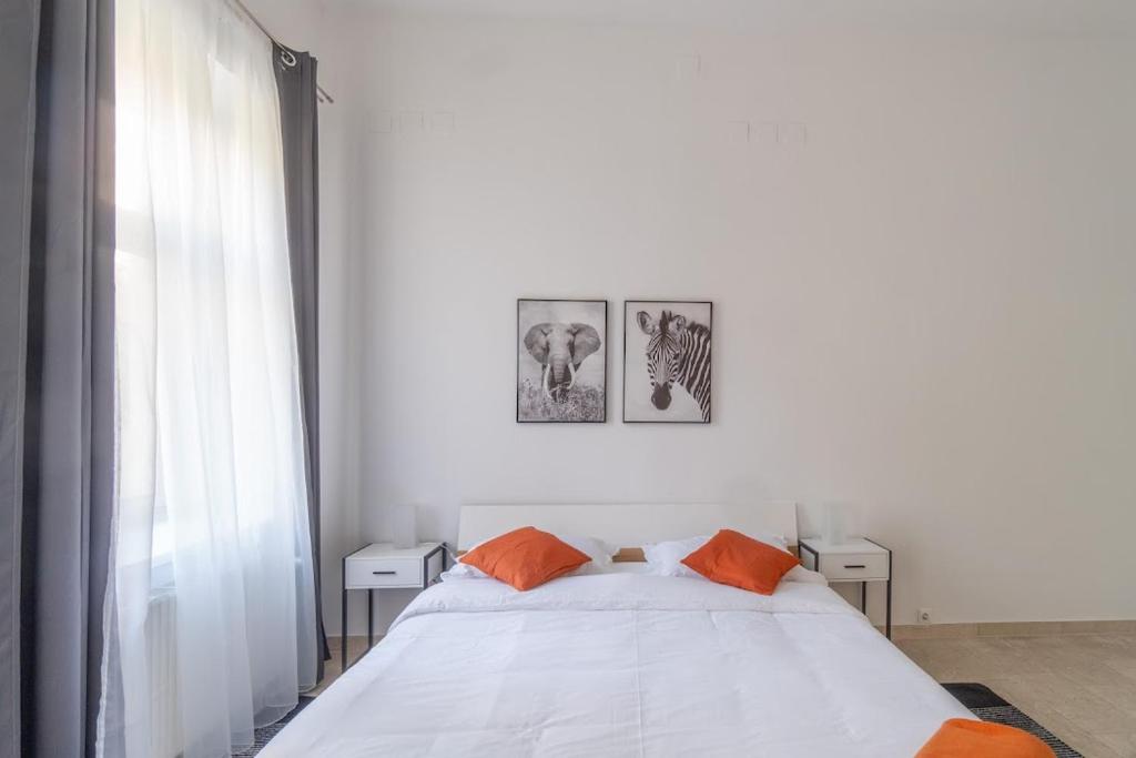 Postel nebo postele na pokoji v ubytování Centre Apartments