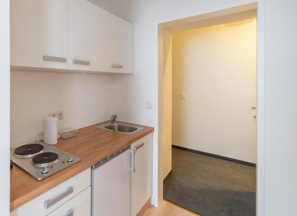 Kuchyň nebo kuchyňský kout v ubytování Centre Apartments