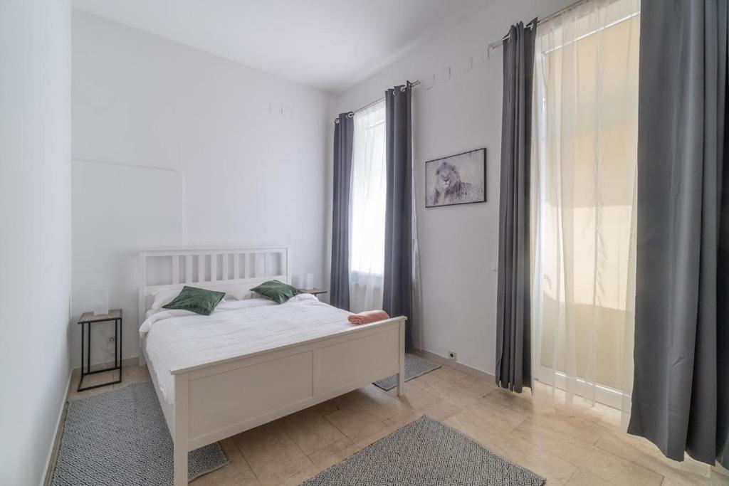 Postel nebo postele na pokoji v ubytování Centre Apartments
