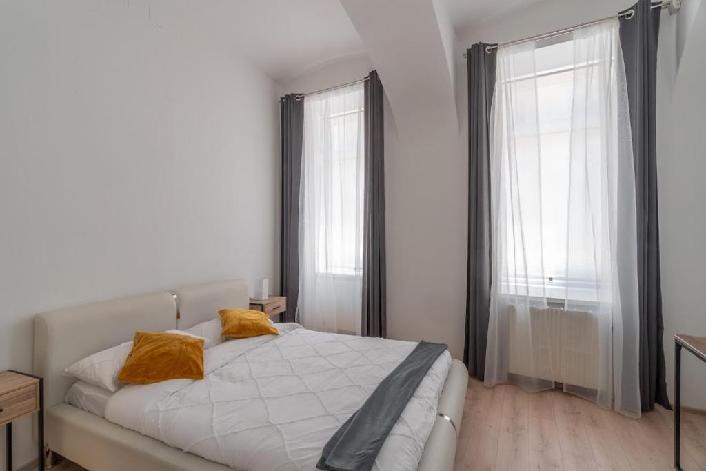 Postel nebo postele na pokoji v ubytování Centre Apartments