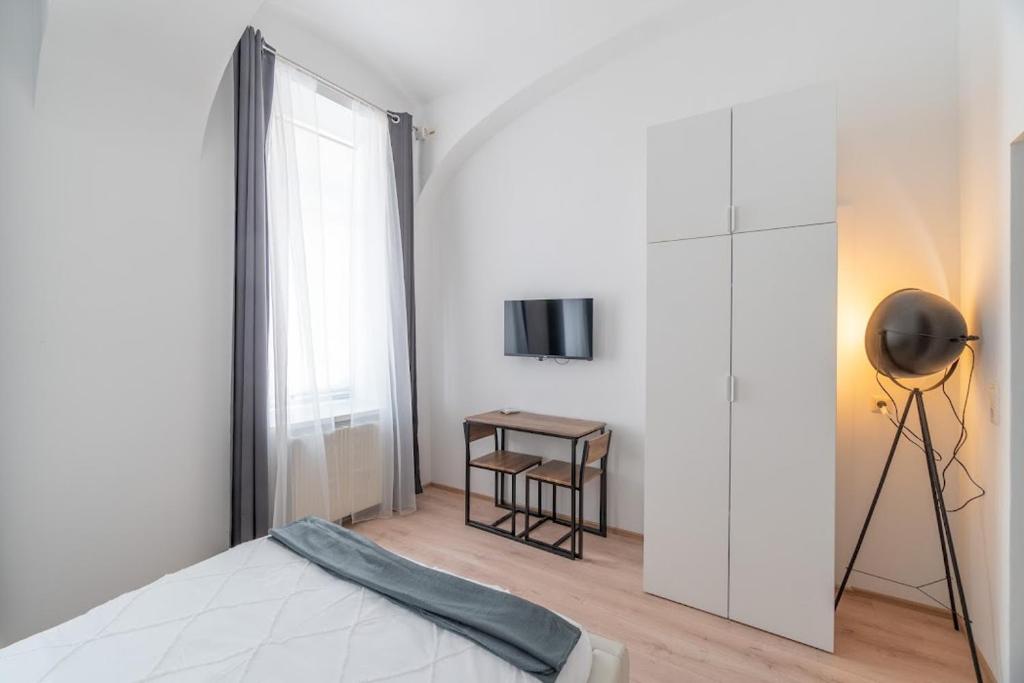 Postel nebo postele na pokoji v ubytování Centre Apartments