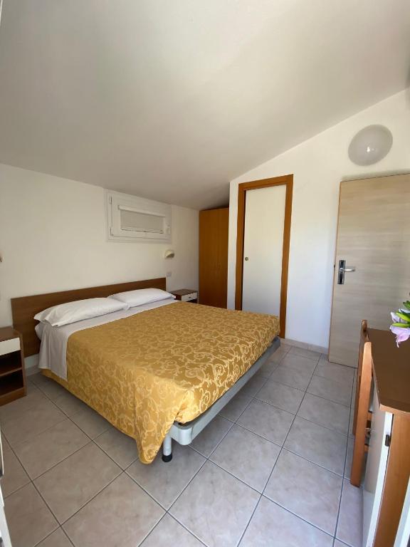 Postel nebo postele na pokoji v ubytování Albergo Villa Aida