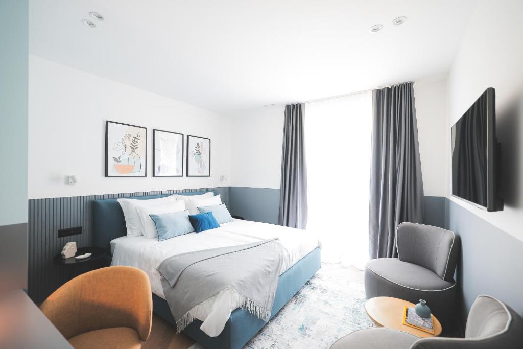 En eller flere senge i et værelse på 11 11 Apartment Zadar