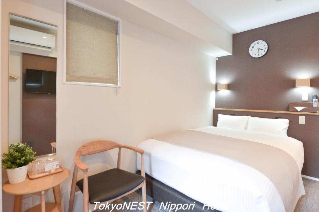 Postel nebo postele na pokoji v ubytování TokyoNEST Nippori