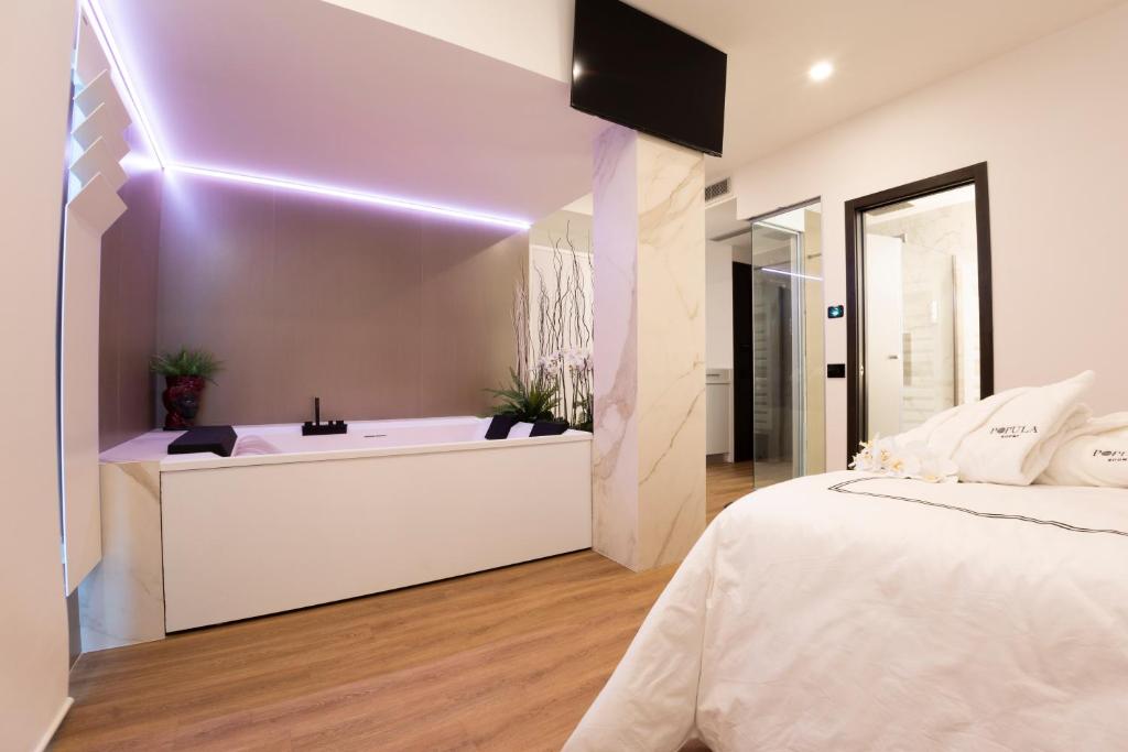 A bed or beds in a room at POPULA - The Lifestyle Hotel