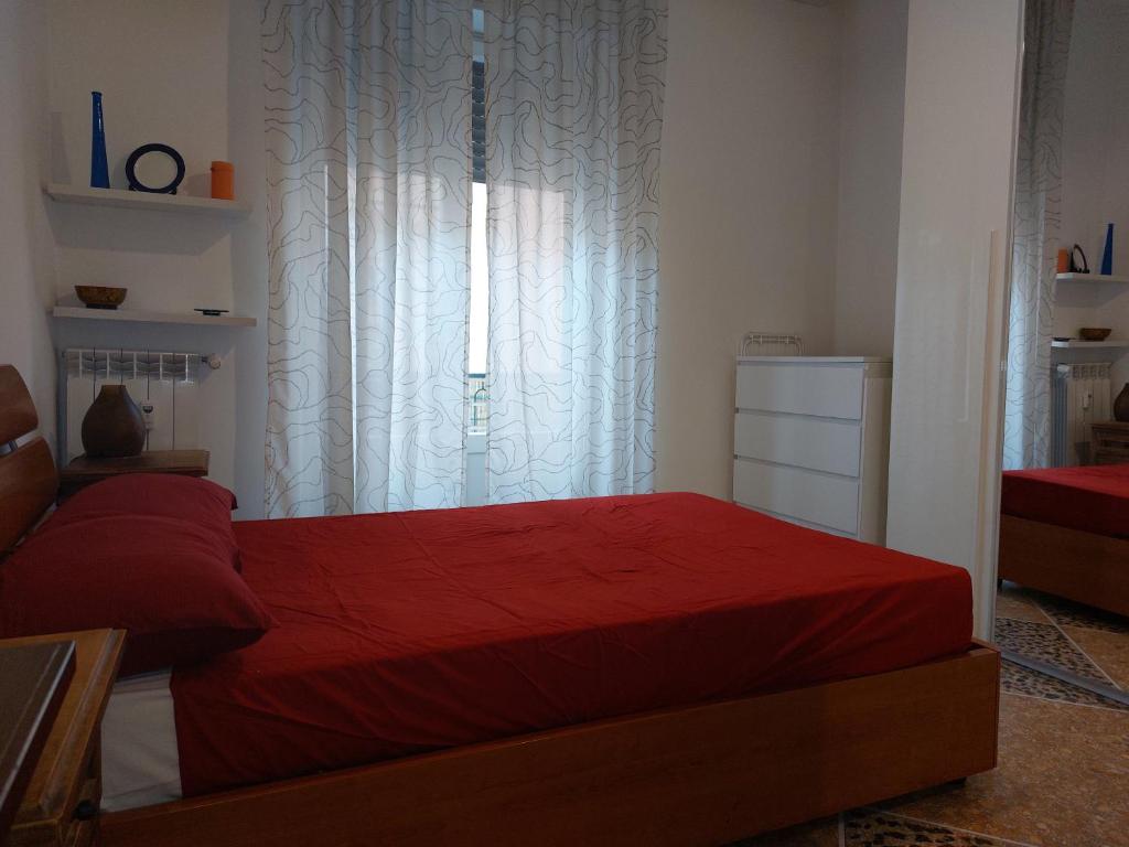 Ένα ή περισσότερα κρεβάτια σε δωμάτιο στο Casa Giova: bilocale con balcone al Gianicolo
