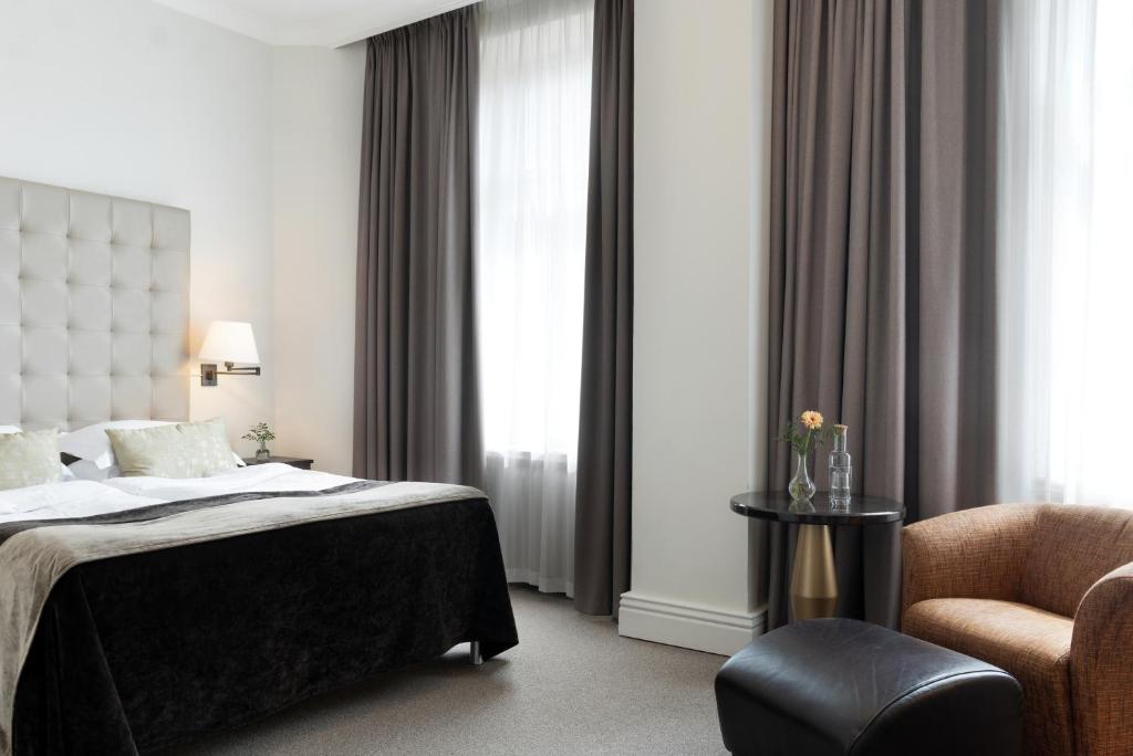 Postel nebo postele na pokoji v ubytování Elite Hotel Knaust