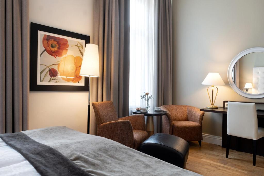 Postel nebo postele na pokoji v ubytování Elite Hotel Knaust
