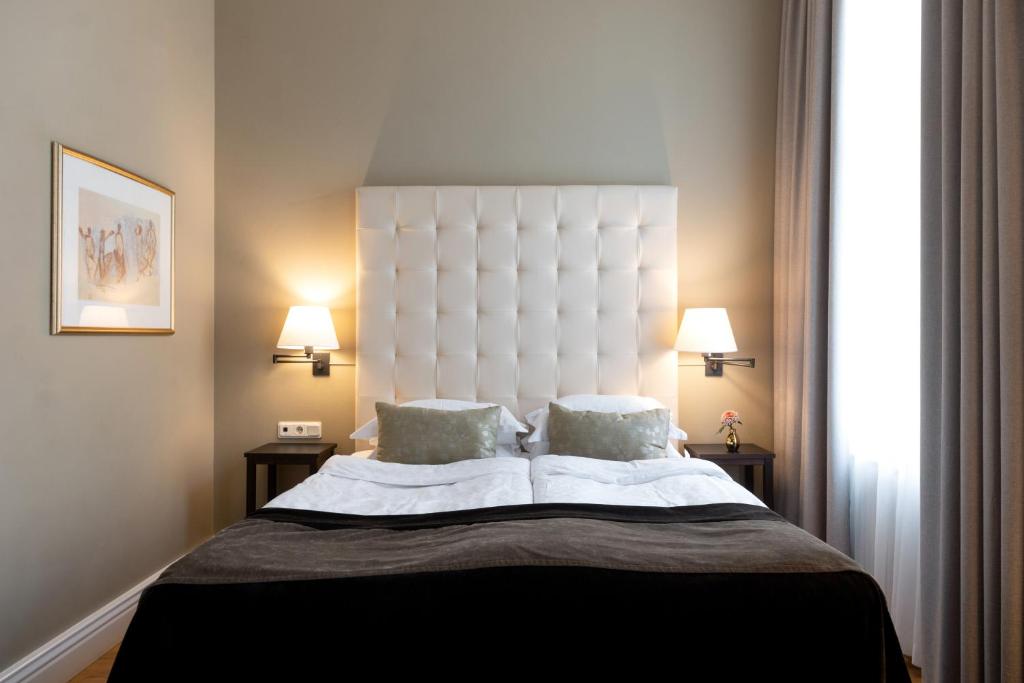 Postel nebo postele na pokoji v ubytování Elite Hotel Knaust