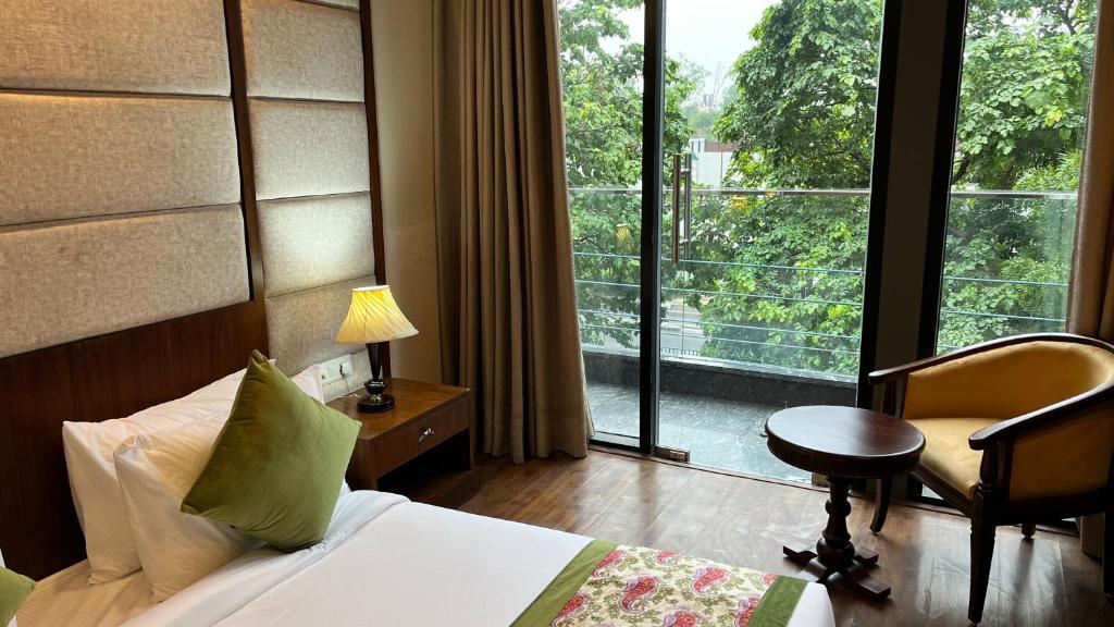 Postel nebo postele na pokoji v ubytování IP Royal Hotel - New Delhi