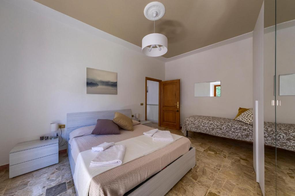 Łóżko lub łóżka w pokoju w obiekcie Mugello Circuit - B & B - L'aia dì Trippa all'Aria