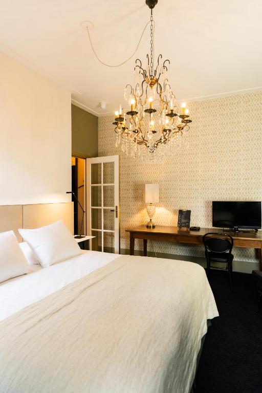 Postel nebo postele na pokoji v ubytování Boutique hotel Villa Trompenberg