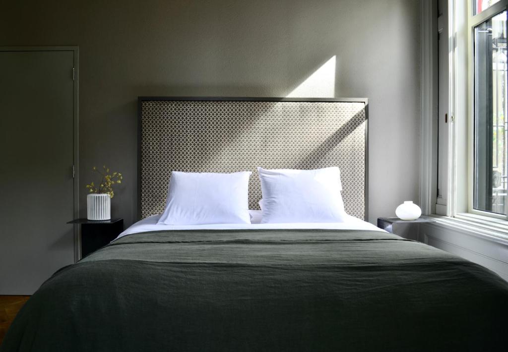 Postel nebo postele na pokoji v ubytování Boutique hotel Villa Trompenberg