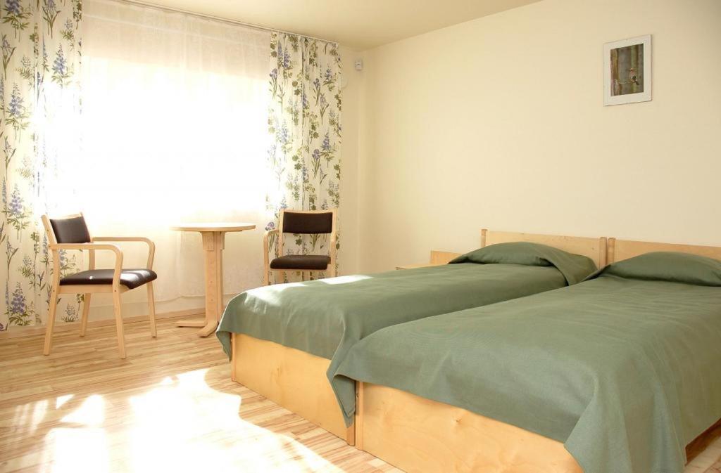 Postel nebo postele na pokoji v ubytování Laululinnu Guesthouse