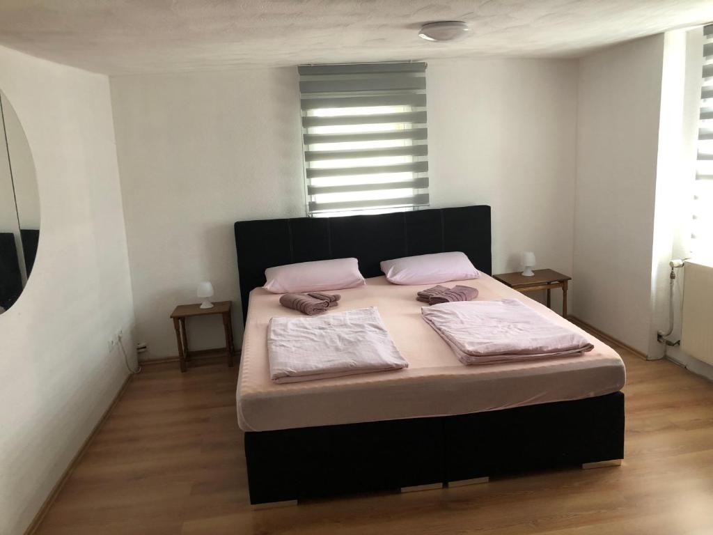 Postel nebo postele na pokoji v ubytování Seven‘S Apartments I