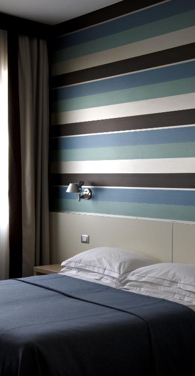 Postel nebo postele na pokoji v ubytování Key Hotel