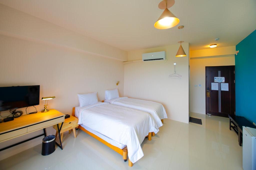 Postel nebo postele na pokoji v ubytování Shui Shang Yuan Homestay