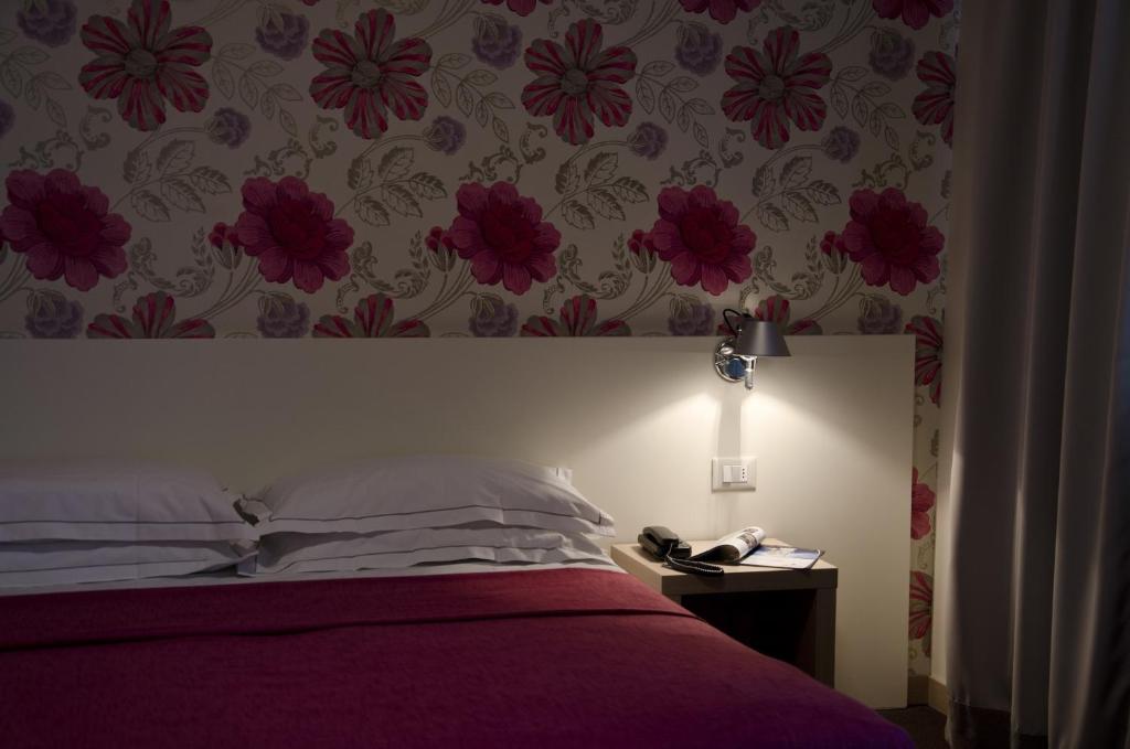 Postel nebo postele na pokoji v ubytování Key Hotel