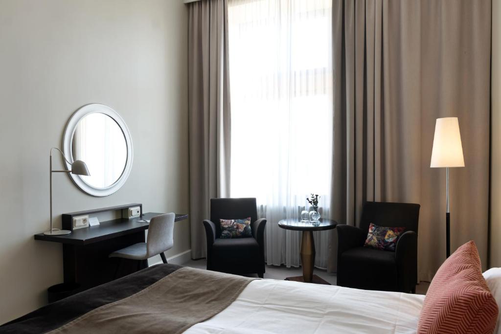 Postel nebo postele na pokoji v ubytování Elite Stadshotellet Luleå