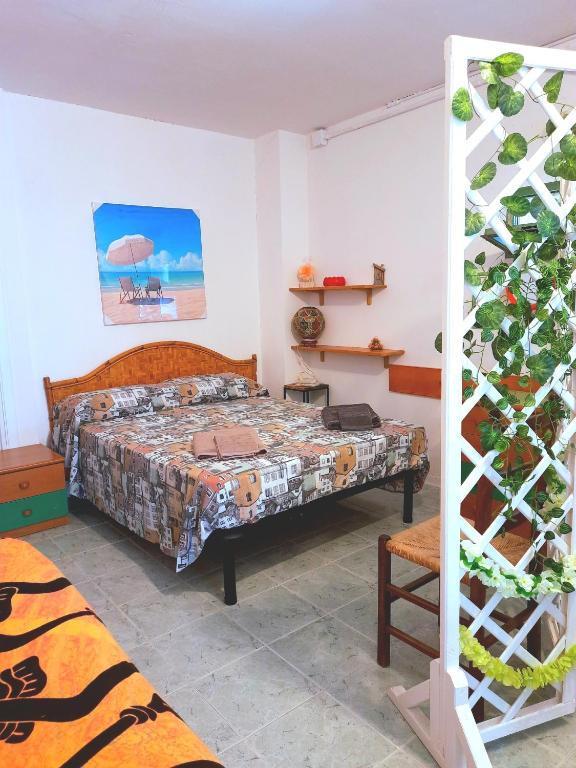 Postel nebo postele na pokoji v ubytování LA QUERCIA SUITES - taverna nel borgo medievale