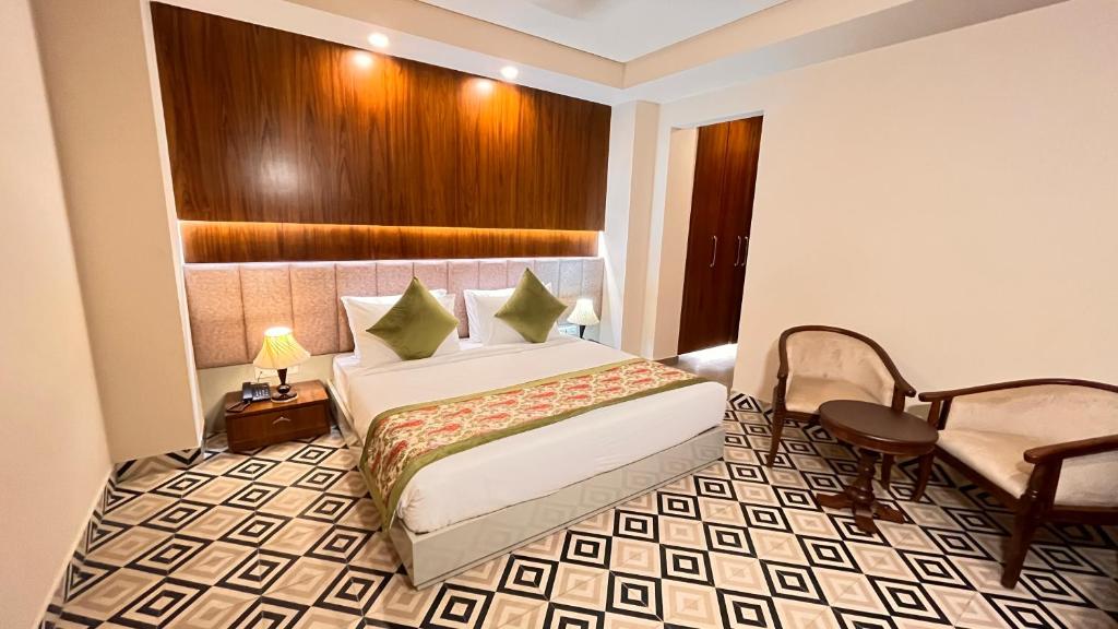 Postel nebo postele na pokoji v ubytování IP Royal Hotel - New Delhi