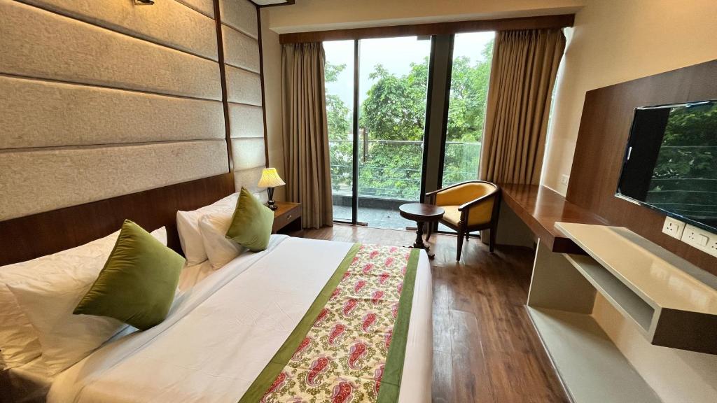 Postel nebo postele na pokoji v ubytování IP Royal Hotel - New Delhi