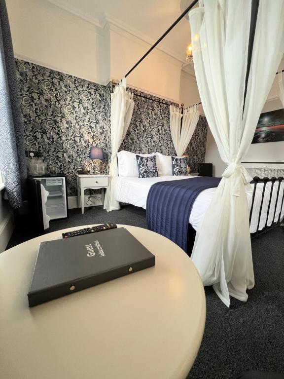 Postel nebo postele na pokoji v ubytování Birkdale Guest House