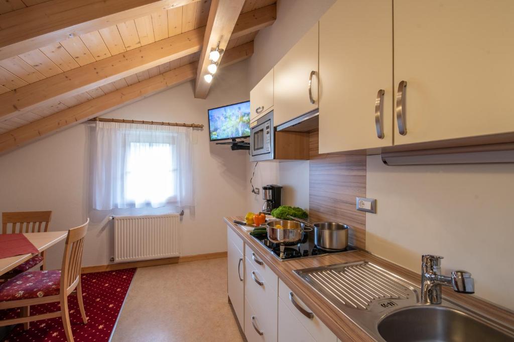 Kuchyňa alebo kuchynka v ubytovaní Residence Mühlegg
